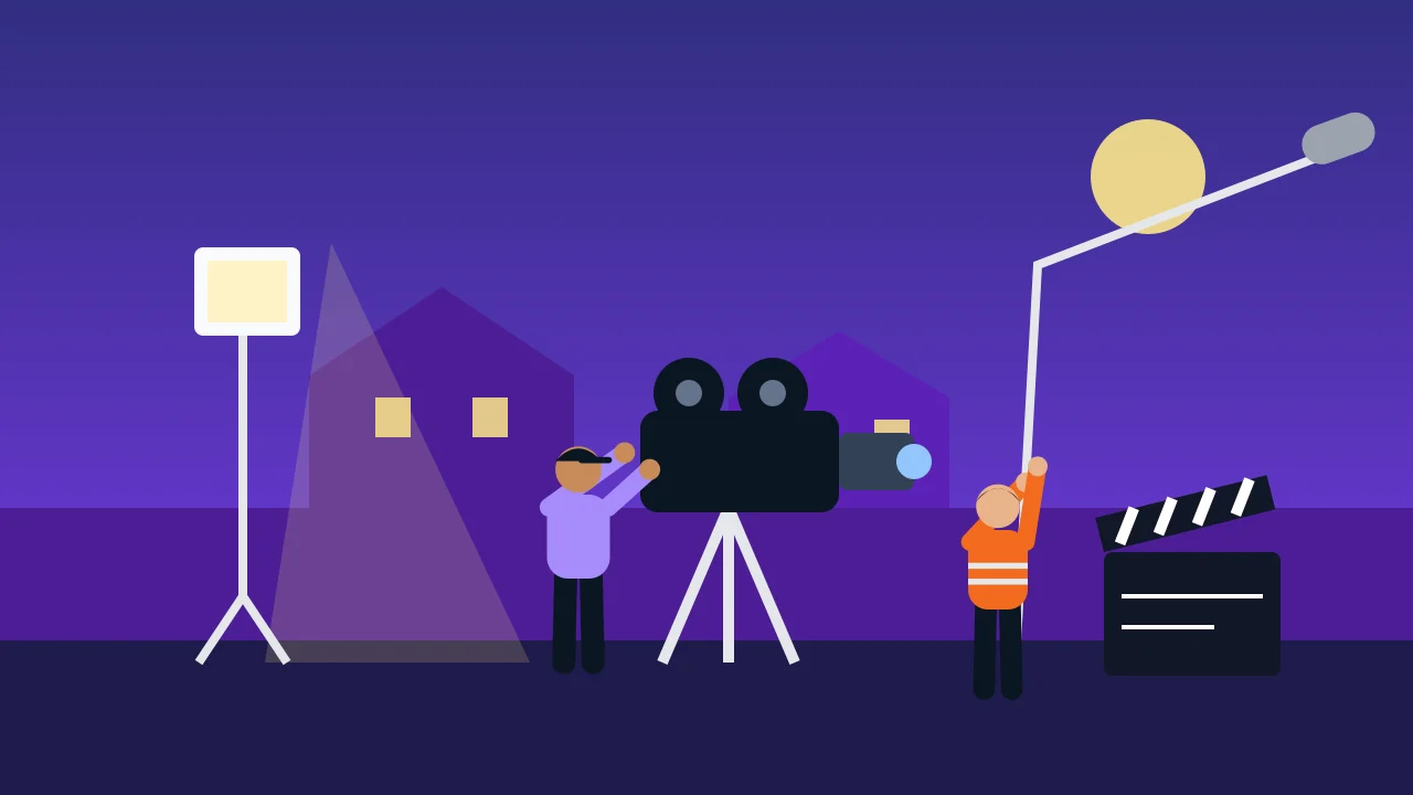 A film crew in a residential street at dusk with a camera, light, boom microphone and clapperboard